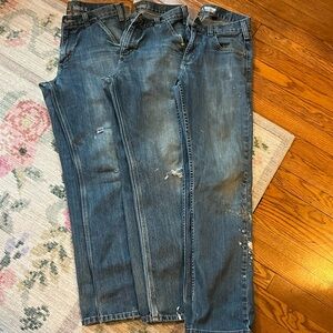 Three pairs of used Carhartt work jeans